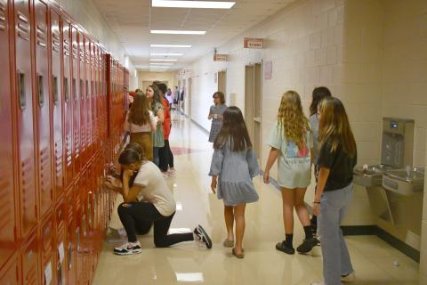 Enoch Autry/The Clayton Tribune. Rabun County Middle School students get their first chance to try out their new school lockers. Below:RCES student Reese Dean selects the book “Ranger In Time” from the school library.