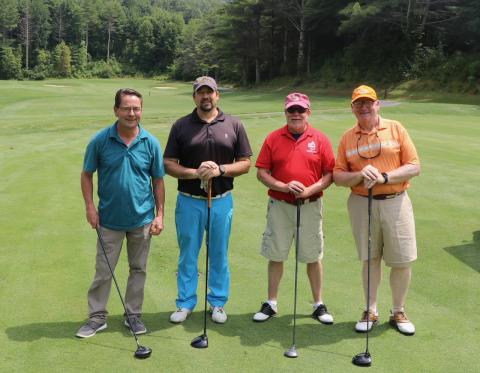 Submitted photos. The tournament team of Ron Barteski, Luke Fogarty, Dan Magliota and Chris Pence are ready to tee off at the next hole at the Sky Valley Country Club. Left: Ken Walton, Vickie Heher and Patrick Heher watch as Roberta Walton lines up her putt during the Sid Weber Memorial Cancer Fund Annual Golf Tournament. Ken Walton is the current SWMCF president.
