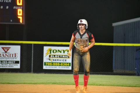 Wade Cheek The Clayton Tribune. RCHS shortstop Mili Watts taking a healthy lead at second base against Elbert County on Tuesday night.