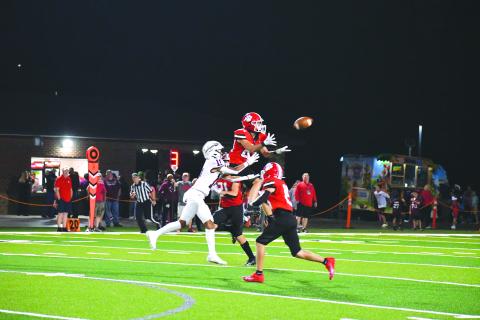 Wade Cheek/The Clayton. Tribune junior Jake Payne elevates over Heard County receiver Brody Buc Cofield to secure one of the Wildcats’ three interceptions in last Friday’s 45-13 win over the Braves. RCHS now is No. 5 in state.