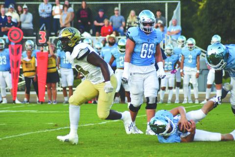 Enoch Autry/The Clayton Tribune. Sophomore James “Tank” Carrington registers one of his three sacks in the game. Carrington now is a five-star and one of the top players in the nation. 