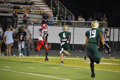 Wade Cheek/The Clayton Tribune. Rabun County defensive back Willie Goodwyn escapes from Adairsville defenders en route to scoring his first touchdown in last Friday's 35-20 victory over the Tigers. 
