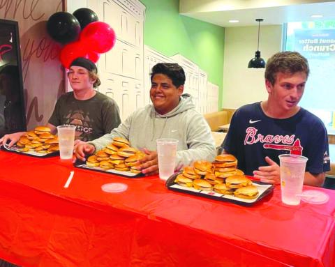 Submitted. Rueben Fuentes (center) prepares for the event with his teammates/competitors Alex Yearwood and Carver Jarrard.