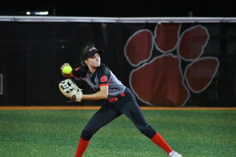 Wade Cheek/The Clayton Tribune. Lady Cat second baseman Hailey Harvey prepares to throw out a Commerce baserunner .