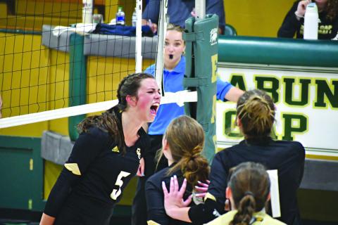 Wade Cheek/The Clayton Tribune. Eagle senior Peyton Brady (5) screams with her teammates while celebrating an Rabun Gap-Nacoochee point against Rabun County on Aug. 31. RGNS currently is ranked No. 7.