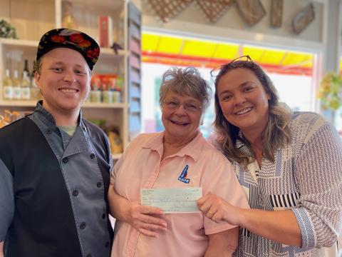 Submitted photo. The Aug. 21 Spaghetti Dinner Raise a Fork for Great Causes fundraiser at Clayton Cafe & Market raised $4,550 for Rabun Paws 4 Life. Pictured are Chef Seth Curtis (left), Bonnie Edmonds, owner/operator of Clayton Cafe & Market, and Ara Joyce. 