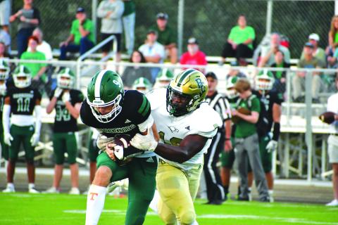 Wade Cheek/The Clayton Tribune. Coming from Baltimore, Md., defensive lineman James “Tank” Carrington made his Eagle debut as he registered two sacks of Christ School quarterback Mason Holtzclaw.