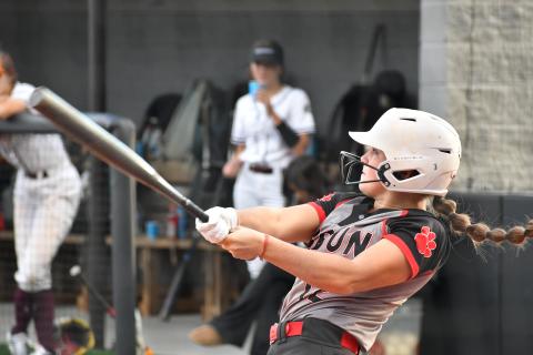 Wade Cheek/The Clayton Tribune. Lady Cat senior shortstop Mili Watts cracks a two-run home run over the right field wall to increase RCHS’s lead to 4-0 against Chestatee on Monday night. The Lady Cats won the game 13-1.