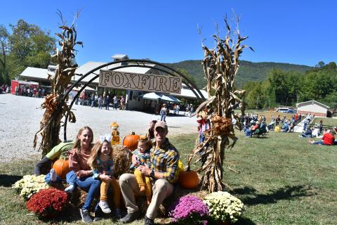 Megan Horn/The Clayton Tribune. Tory and Megan Holton enjoy their family time at the Foxfire Mountaineer Festival with Anniston, 5, and Avery, 1, last Saturday. The annual event was held in downtown Clayton at the pavilions.