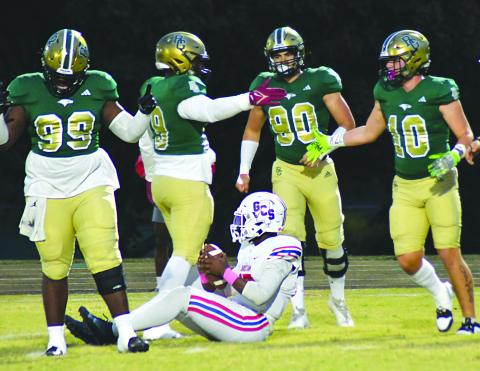 Enoch Autry/The Clayton Tribune.  RGNS’s Ezra Burress (10) celebrates one of the team’s total 11 sacks of Greenville Christian’s QB Jaylen Bester with teammates Terry Nwabuisi-ezeala, Tank Carrington and Hector Gonzaleza. 