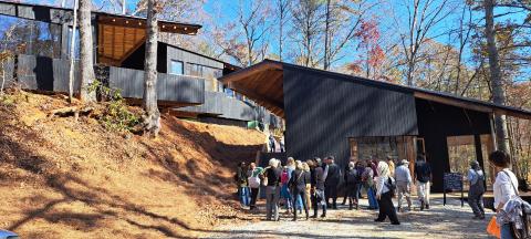 Megan Horn/The Clayton Tribune. Community members showed out to the Hambidge Center in Rabun Gap Nov. 4 for the open house for the new Antinori Village Saturday, Nov. 4. The campus was open with tours of the Antinori Village and workshop spaces, with live music, resident artist studio tours, delicious food and other fun activities. Left: Photo courtesy Forward Rabun/Rabun County Chamber of Commerce. Forward Rabun/Rabun County Chamber of Commerce congratulated the Hambidge Center on their ribbon cutting.