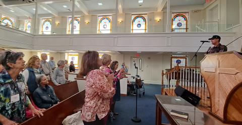 Megan Horn/The Clayton Tribune. A well-attended crowd was emotional, praising Jesus as singer/songwriter Kristian Stanfill was a guest performer for the Ladies’ Community Bible Study group at Clayton Baptist Church on Oct. 10. Stanfill has local ties to the Rabun County community.