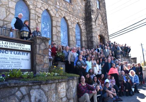 Submitted photo. Members of the Clayton First United Methodist Church gather outside the church on South Main Street in Clayton for a photograph at the 100th anniversary event. Below: Clayton Mayor Kurt Cannon (left) presents a framed proclamation to the church.