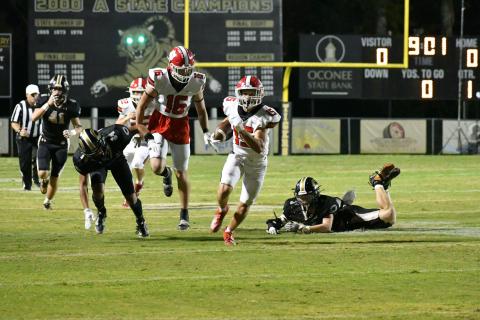 Wade Cheek/The Clayton Tribune. Rabun County sophomore running back Reid Giles sprints to the end zone in last Friday’s region loss to Commerce. Should the Wildcats had won, they would have won their 10th-straight region championship. 