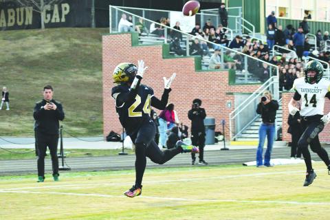 Wade Cheek/The Clayton Tribune. RGNS wide receiver Natey Fom cradles in a wide-open touchdown catch to extend the Eagles lead in last Friday’s first round of the tourney. 