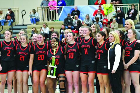 Wade Cheek/The Clayton Tribune. The Rabun County Lady Cats hoist the trophy from the Piedmont University Hardwood Classic after defeating Class AA Union County 82-80 as RCHS came back from being 19 points behind. The Lady Cats were led in the game by senior Lucy Hood who scored 41.