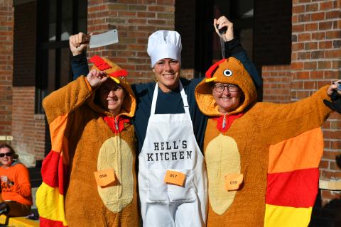 Wade Cheek/The Clayton Tribune. It looks like imminent demise for “turkeys” Regina Talley and Catherine Streible as Hell’s Kitchen chef  Nikki Zigler readies to do some carving. These costumed ladies were among the participants in the Turkey Trot event to raise money for the Food Bank of Northeast Georgia. The run was held on Thanksgiving morning. Read more about the fundraising effort on page B1 of this week’s edition.