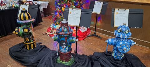 Megan Horn/The Clayton Tribune. These fire hydrants were decorated by local artists Amy Jarrard, Lizzy Falcon and Kip Ramey and auctioned off during this year’s  Holiday Market and Festival of Trees. The event raised $10,573 for Rabun Paws 4 Life. 