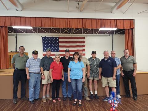 File photo/Megan Horn/The Clayton Tribune. Pictured are Mountain City Council Member Michael Holt (left); veteran Doug Wayne; veteran Jon Jones; Mayor Grace Watts; veteran Gary Cantwell; Council Member Brenda Hooper; veteran David Cross; veteran David Ruth; Council Member Robert Sutton; veteran Bill Fountain and veteran Chris DiNofrio during the city’s proclamation of being “A Purple Heart City” in 2022. Not pictured is Council Member Eric McCrackin.
