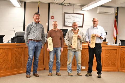 Megan Horn/The Clayton Tribune. Clayton Mayor Kurt Cannon recognizes outgoing council members Woody Blalock, David Cross and John Bradshaw for their years of service to the city. The three council members were presented with awards during Tuesday’s meeting and honored with a community reception. 