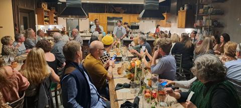Megan Horn/The Clayton Tribune. Carlton Chamblin and Local Chef Alex Stein speak to guests during the event. 