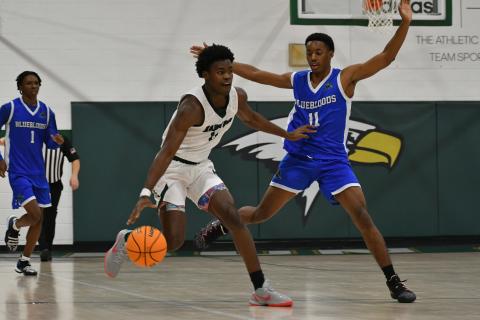 Wade Cheek/The Clayton Tribune. Eagle junior wing R.J. Lacossade battles a full-court press against New Faith Christian Academy on Nov. 30. 