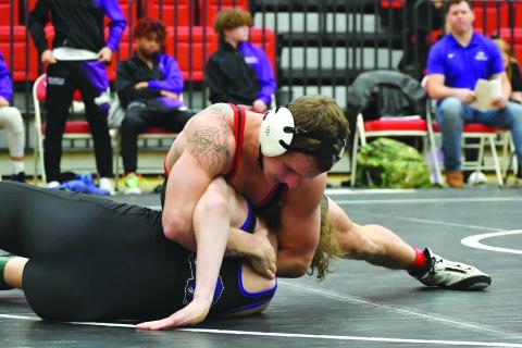 Wade Cheek/The Clayton Tribune. Rabun County’s Noah English pins his 165-pound opponent from Walhalla during the RCHS wrestling teams’ first home meet on Dec. 5. The Wildcats fell to Walhalla 48-32 but defeated 45-24.