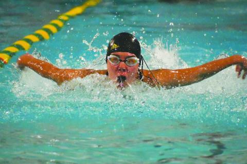 Wade Cheek/The Clayton Tribune. Rabun Gap-Nacoochee swimmer Kathryn Stribling extends her arms in a butterfly motion during the Eagles’ home meet on Friday, Dec. 1. Stribling helped lead the Lady Eagles to first place as a team. 