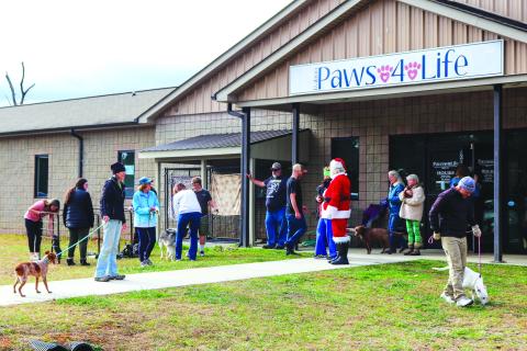 Photo courtesy of Lisa Broz. Over 100 people in the community volunteered to walk dogs and spend time with kittens during the “Walking Paws” event at Rabun Paws 4 Life Dec. 23. There were also four adoptions during the event. 