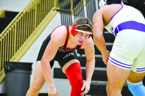 Wade Cheek/The Clayton Tribune. RCHS grappler Celton Littrell sizes up his Athens Christian opponent during last weekend’s area duals match on Jan. 13. The 175-pounder won the match, helping the Wildcats go 2-2 throughout the day after defeating the Eagles and area opponent Towns County. 
