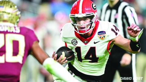 Dawg Post. Current Bulldog and former Rabun County star quarterback, Gunner Stockton, weaves his way through Hard Rock Stadium in Miami during the Orange Bowl. The redshirt freshman threw for 96 yards and two TDs.