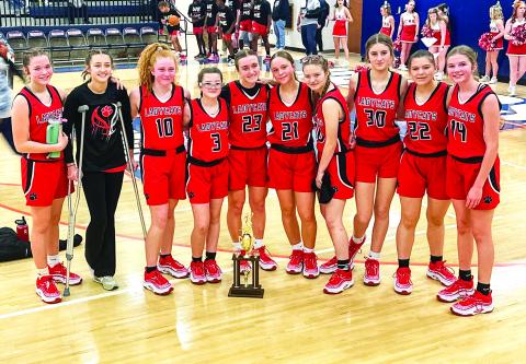 Photo provided to The Clayton Tribune. RCMS seventh and eighth-grade Lady Cats stand with their hardware after earning runner-up after last Saturday’s middle school tournament championship game. RCMS defeated Stephens County 50-20 in the semi-final but lost to Elbert County in the title game 42-36. (From left) Lady Cats Kinsey Huff, Cheyenne Queen, Irie McElroy, Maci Dixon, Millie Southards, Sophie Provance, Shay Woods, Cecelia Fields, Danni Blalock and Lydia Gergani. Melissa Weeks is the head coach. 