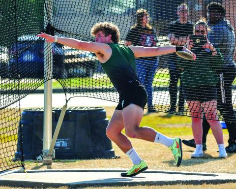Wade Cheek/The Clayton Tribune. Tallulah Falls Sam Ketch prepares to launch the discus during his senior season for the Indians. Ketch, who also excels in the shot put, has signed with Davidson College to join its track and field team.
