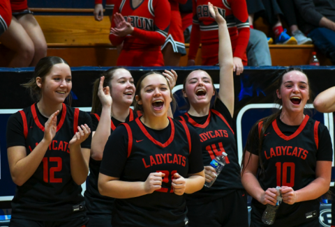 Wade Cheek/The Clayton Tribune. RCHS Lady Cat hoopers (from left) Conley Spivey, Chloe Erlewine, Loren Mazarky, Jamie McCall and Mili Watts celebrate their fellow basketball teammates from the sideline of last Friday’s region battle with Elbert County on Jan. 19. The Lady Cats have a lot to be happy about these days. As of Thursday, Jan. 25, RCHS head coach DeeDee Dillard and the Lady Cats are 16-5 and 3-1 in region play. RCHS also is currently the No. 4 team in Georgia Class A Division I. 