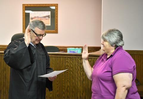 Megan Horn/The Clayton Tribune. Probate Judge Carlton Hobie Jones, III swears in Elections and Voter Registration Director Tammy Whitmire.