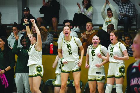 Wade Cheek/The Clayton Tribune. Rabun Gap-Nacoochee got wins over Carolina Day on Jan. 24. ABOVE: The RGNS girls celebrate their teammates’ play. 