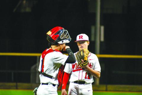 Wade Cheek/The Clayton Tribune. Rabun County pitcher and second baseman Hunter Giles has a meeting at the mound with sophomore catcher Noah English during the Wildcats’ home opener versus Union County on Feb. 14. 