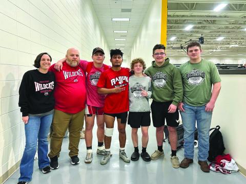 Submitted. Wrestling coaches Brent and Jenna Hinkel stand with the five Wildcats who qualified for the GHSA wrestling state championship that will be held from today, Feb. 15 through Feb. 17. The wrestlers are (from left) following Hinkel; Celton Littrell, Rodolfo Ramos, Bryson Hunt; Justin Cody and Evan Hopper. 