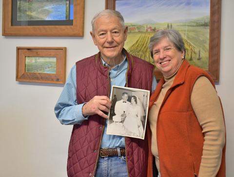 Megan Horn/The Clayton Tribune. Dr. Tom and Becky Callahan reminisce on their 63 years of marriage together as they hold a picture from their wedding day on June 18, 1960. The couple was married at Trenton Street Baptist Church in Harriman, Tenn. 