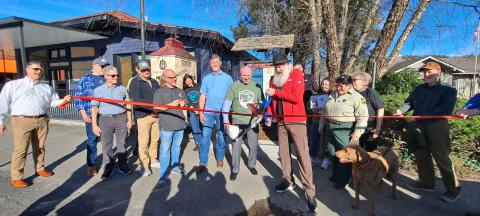 Megan Horn/The Clayton Tribune. Forward Rabun/Rabun County Chamber of Commerce cuts the ribbon on the new Appalachian Trail (AT) Community Kiosk located near the Rock House on Main Street in Clayton March 7. Community citizens, officials from the City of Clayton and county, and AT Community Committee members participated in the event. 