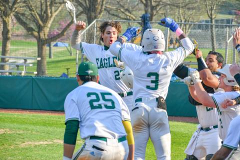Wade Cheek/The Clayton Tribune. RGNS junior outfielder Jeremy Ramos celebrates with his Eagle teammates after hitting one of his four home runs during Rabun Gap’s 23-0 win over Carolina Day School on Tuesday, March 19. 