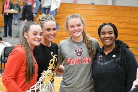 Wade Cheek/The Clayton Tribune. Lady Cat basketball seniors from left Mili Watts, Ellie Southards, Lucy Hood and Isia Wilmont stand together after defeating Athens Christian in the region title game earlier this year. 