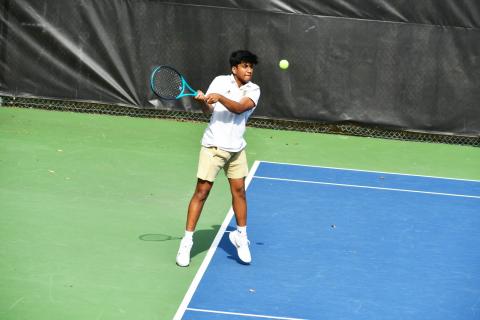 Wade Cheek/The Clayton Tribune. RGNS tennis player Om Patel returns a serve from his Asheville School opponent during a conference match on Thursday, March 21. As of Tuesday, March 26, the Eagles are 3-1 in the 2024 season. 