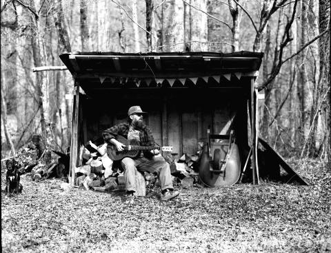 Photo courtesy Ronnie Pettit. This black-and-white photograph by Ronnie Pettit shows Rabun County resident Scott Low as he promotes his new album “Appalachian Blues.” Low has release parties scheduled in three states.