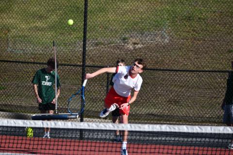Wade Cheek/The Clayton Tribune. Wildcat Robbie Fountain serves.