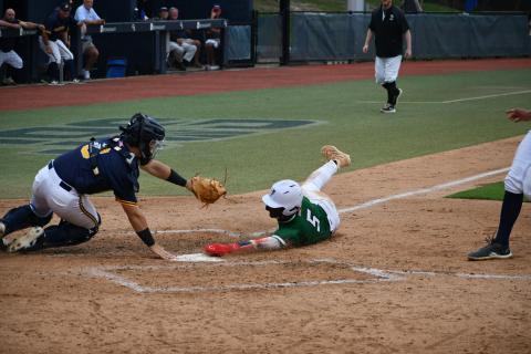 Wade Cheek/The Clayton Tribune. ABOVE: Talluah Falls School junior outfielder Danny Grant extends his hand into home plate for a run in the state title but is called out after a controversial call that helped Prince Avenue come back and win Game One of this year’s Class A D-I state title. 