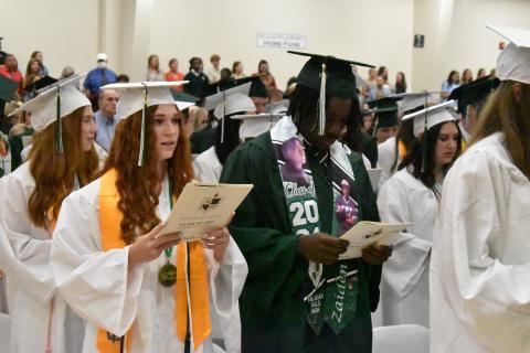 Matthew Osborne/CNI News Service. Tallulah Falls School seniors Jenna Chesser and Zaiden Cox join their Class of 2024 in singing during the May 24 morning commencement at the school.