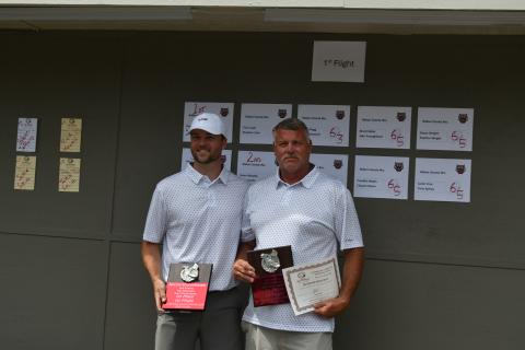 Wade Cheek/The Clayton Tribune. Nick Howell (left) and Dennis Hendricks collect their first-place awards during the ninth annual golf tournament hosted by the Rabun County Recreation Department at the Orchard Golf and Country Club on Tuesday, June 18. 
