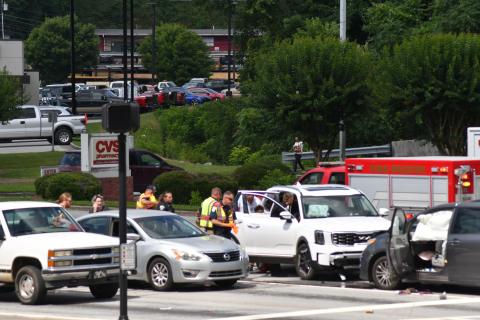 Enoch Autry/The Clayton Tribune. Clayton Police Department officers work the scene of a two-vehicle collision at the intersection of Ga. 15 and Chechero Street the morning of June 20. Minor injuries were reported with the crash. 