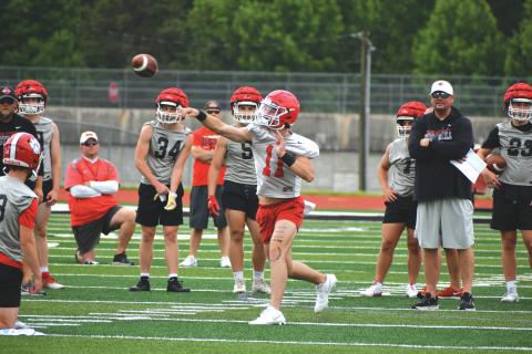 Wade Cheek/The Clayton Tribune. RCHS junior starting quarterback Ty Truelove lets it loose during a 7-on-7 practice with Hart County on June 6. Truelove underwent surgery in December after a torn labrum during the 2023 season. 